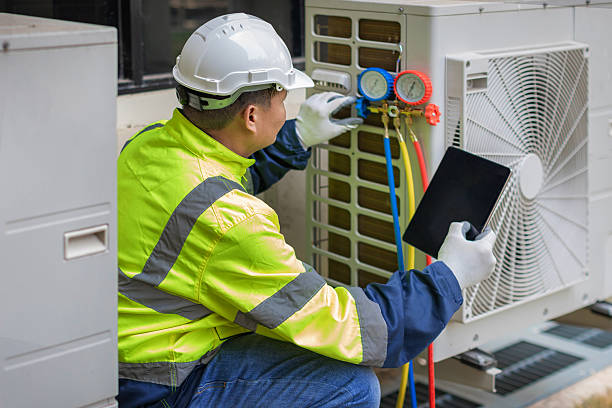Professional Heat Pump Repair technician working in Swepsonville, NC